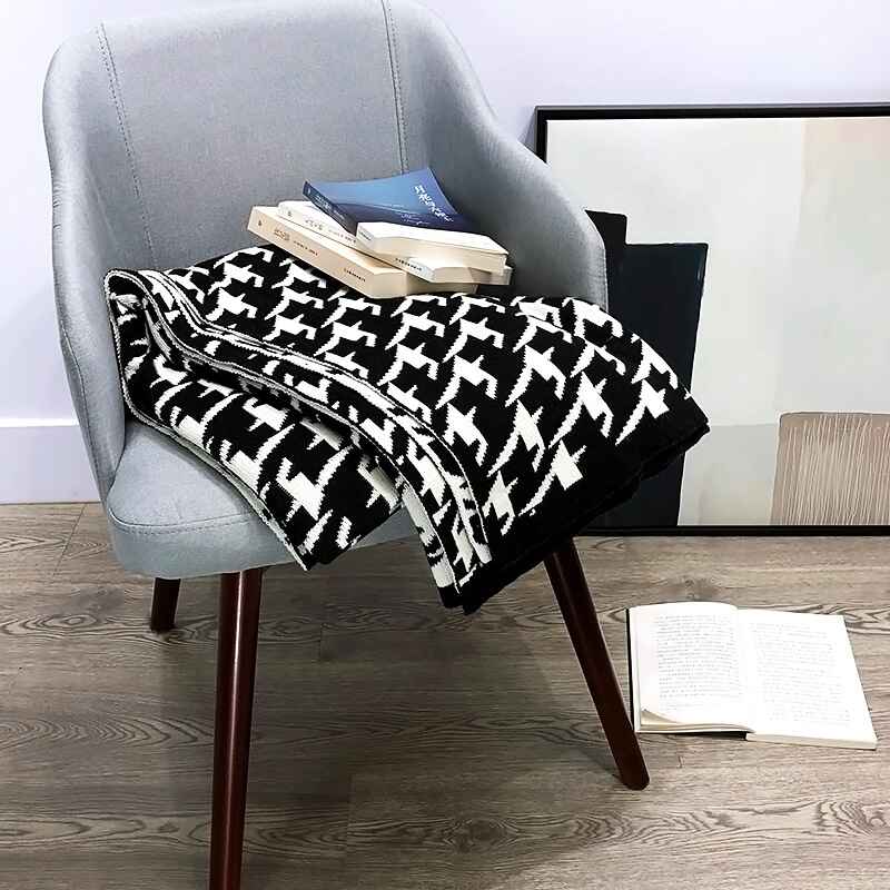 black-and-white-knitted-throw-blanket-on-a-chair