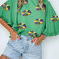 Green Sequin Doughnut Graphic Ruffled Trim Bell Sleeve Mardi Gras Blouse