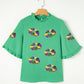 Green Sequin Doughnut Graphic Ruffled Trim Bell Sleeve Mardi Gras Blouse