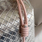 Silvery Lattice Texture Corded Ball Decor Weaven Handle Cosmetic Bag