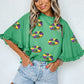 Green Sequin Doughnut Graphic Ruffled Trim Bell Sleeve Mardi Gras Blouse