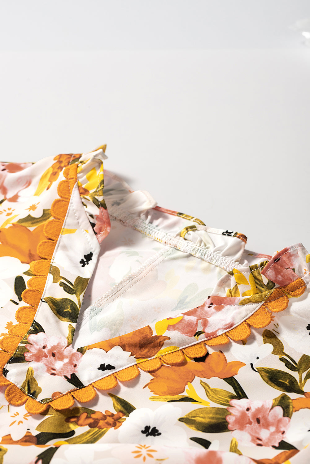 Russet Orange Ruffled V Neck Scalloped Short Sleeve Floral Blouse